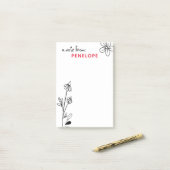 Zwarte en witte flessennaam post-it® notes (Op bureau)