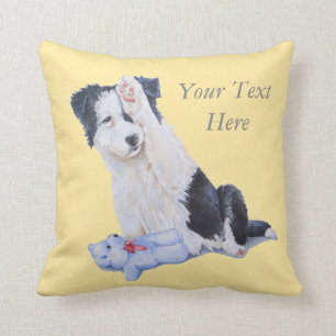 zwarte en witte hond , schattige grenzenpupil kussen