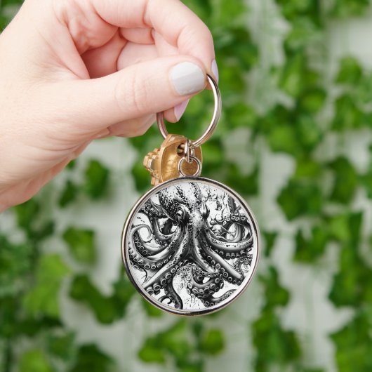 Zwarte en witte octopus lijkt op een eeuwenoude in sleutelhanger (Hand)