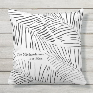 Zwarte en witte palmen met familienaam en jaar buitenkussen