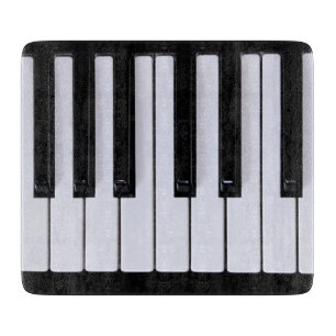 Zwarte en witte pianoketoestel snijplank