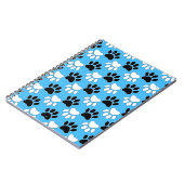 Zwarte en witte poten in nood op blauwe achtergron notitieboek (Linkerzijde)