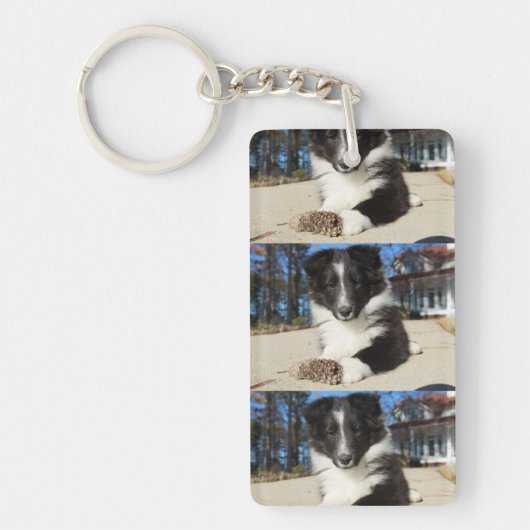 zwarte en witte puppy sleutelhanger (Voorkant)