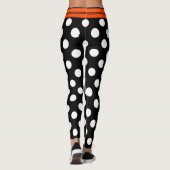 Zwarte en witte retropolka-punten met oranje stree leggings (Achterkant)