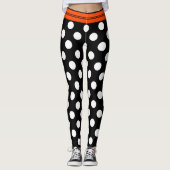 Zwarte en witte retropolka-punten met oranje stree leggings (Voorkant)