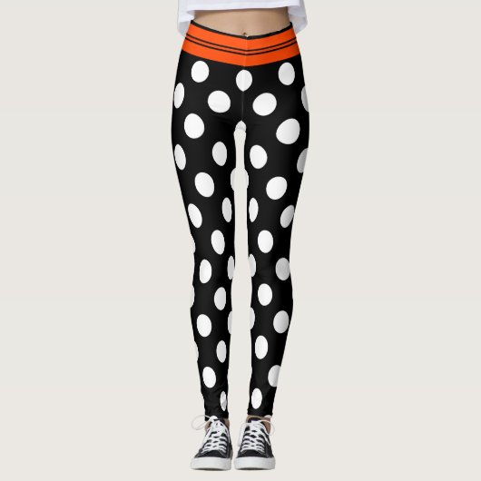 Zwarte en witte retropolka-punten met oranje stree leggings (Voorkant)