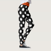 Zwarte en witte retropolka-punten met oranje stree leggings (Rechts)