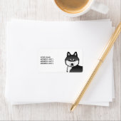 Zwarte en witte siberische hondje en aangepaste te etiket (Insitu)