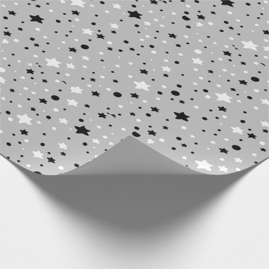 zwarte en witte sterren op grijs cadeaupapier (Hoek)