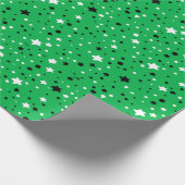 zwarte en witte sterren op groen cadeaupapier (Hoek)