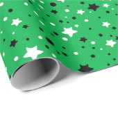 zwarte en witte sterren op groen cadeaupapier (Rol Hoek)