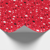 zwarte en witte sterren op rood cadeaupapier (Hoek)