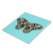 Zwarte en witte vlinder, achtergrond turkooizen tegeltje (Zijkant)