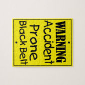 Zwarte gordel voor ongevalsProne Legpuzzel (Horizontaal)