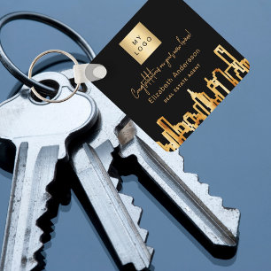 Zwarte goudstad skyline onroerend goed logo sleutelhanger