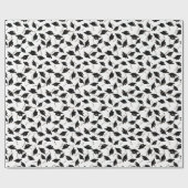 Zwarte gradatiekappen getoseerd in de lucht op wit cadeaupapier (Vlak)