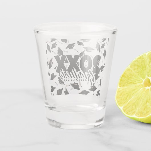 Zwarte gradatiekappen getoseerd in de lucht op wit shot glas (Achterkant)