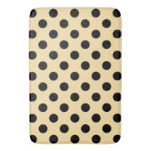 Zwarte haarpunten op bleek geel badmat (Voorkant Verticaal)