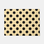 Zwarte haarpunten op bleek geel deurmat (Voorkant)