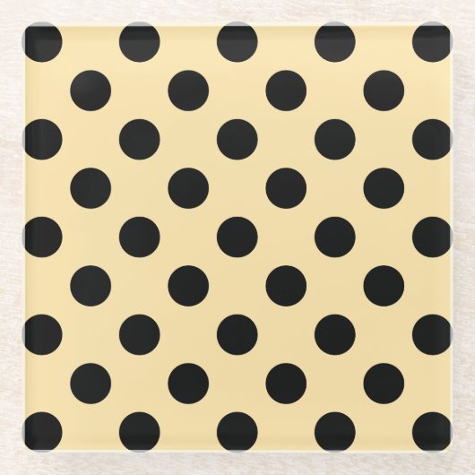 Zwarte haarpunten op bleek geel glazen onderzetter (Voorkant)