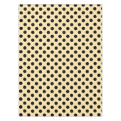 Zwarte haarpunten op bleek geel tafelkleed (Voorkant)