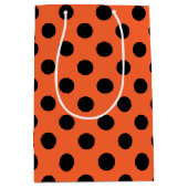 Zwarte haarpunten op oranje medium cadeauzakje (Voorkant)