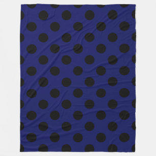 Zwarte haarstaartstippen op blauw fleece deken