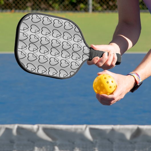 Zwarte harten op de zilverpicklebalpeddel pickleball paddle (Insitu)