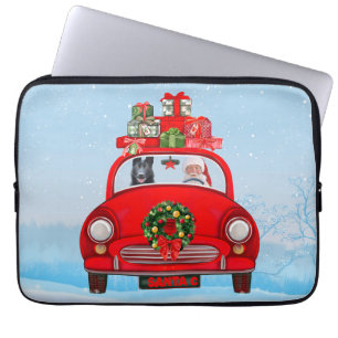 zwarte herderhond in auto met kerstman laptop sleeve