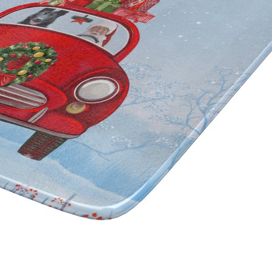 zwarte herderhond in auto met kerstman snijplank (Hoek)