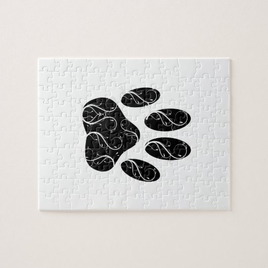 Zwarte hondenpootafdruk met witte krullen legpuzzel (Horizontaal)