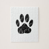 Zwarte hondenpootafdruk met witte krullen legpuzzel (Verticaal)