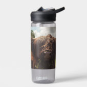 Zwarte hoogland koe grazend groen veld zonlicht waterfles (Links)