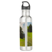 Zwarte hoogland koe grazend groen veld zonlicht waterfles  (Achterkant)