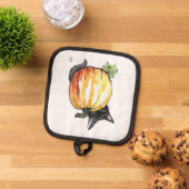 Zwarte kat achter pompoenpothouder pannenlap (Top down)