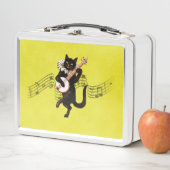 Zwarte kat die banjo speelt op Muzieknoten (In situ)