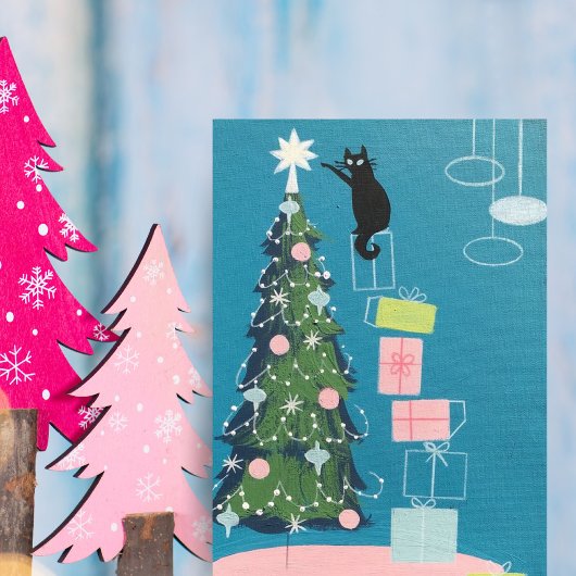  zwarte kat die kerstboom decorreert feestdagenkaart