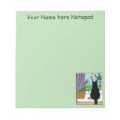 Zwarte kat die uit venster kijkt notitieblok (Voorkant)