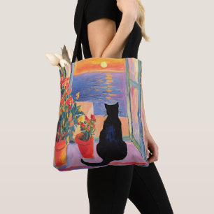 Zwarte kat genietend van het zeezicht tote bag