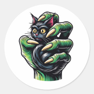 Zwarte kat gevangen door hekserige hand ronde sticker