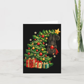 Zwarte kat hangend aan kerstboom feestelijke huisd kaart