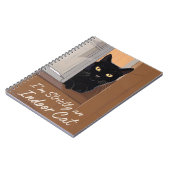 Zwarte kat in het venster notitieboek (Linkerzijde)