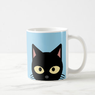 ZWARTE KAT KIJKT UIT ROZE KOFFIEBEEKER KOFFIEMOK