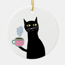 Zwarte kat met een gezellige mok