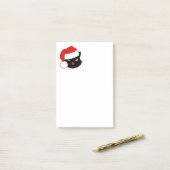 Zwarte kat met een Santa Hat Post-it® Notes (Op bureau)