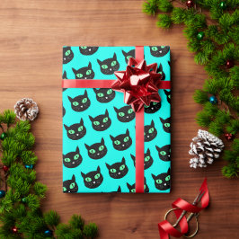 Zwarte kat met groene ogen op turquoise blauw cadeaupapier