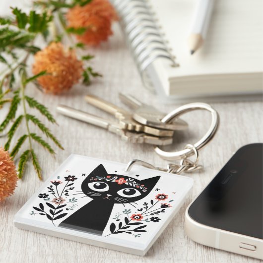 Zwarte kat met grote ogen omringd door bloemen sleutelhanger (Voorkant Rechts)