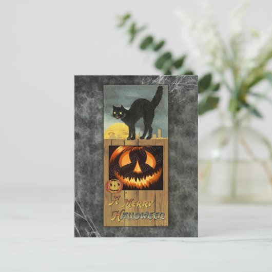 Zwarte kat op een houten hek met pompoen briefkaart (Staand voorkant)