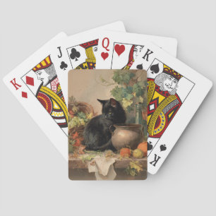 zwarte kat te midden van herfstvruchten pokerkaarten