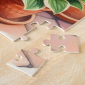 Zwarte kat zittend in Hosta tuin Legpuzzel (Zijkant)